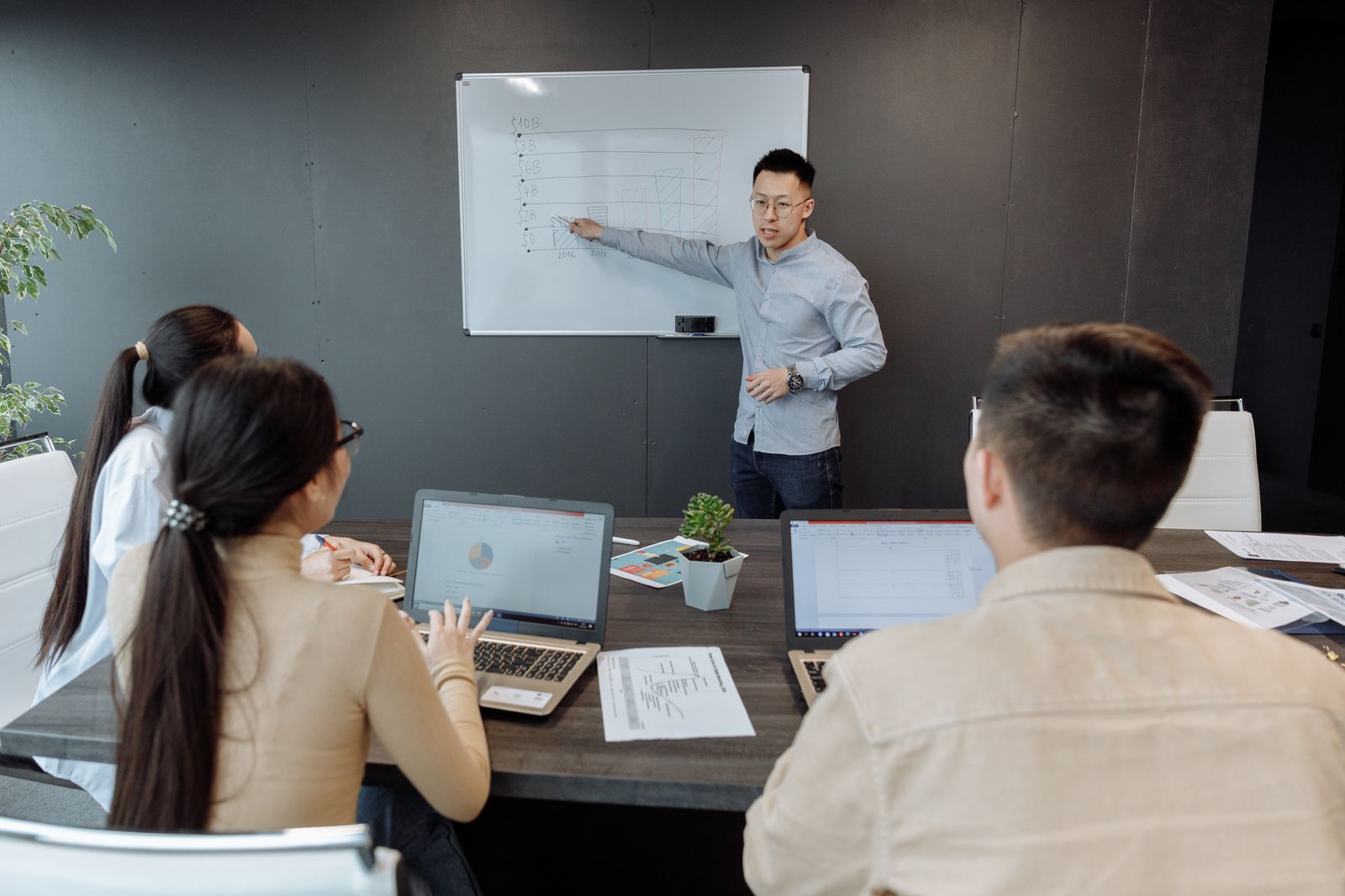 A startup engineering team working together at a laptop